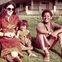 Ann Dunham sits with her father Stanley Dunham and her children, Maya and Barack.