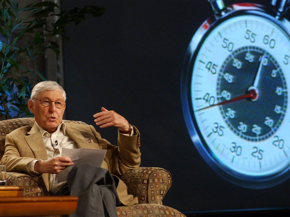 Don Hewitt, pictured in 2004, with the trademark '60 Minutes' stopwatch behind him.