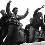 Berliners gathered on the Berlin Wall to celebrate the effective end of the city's partition in 1989