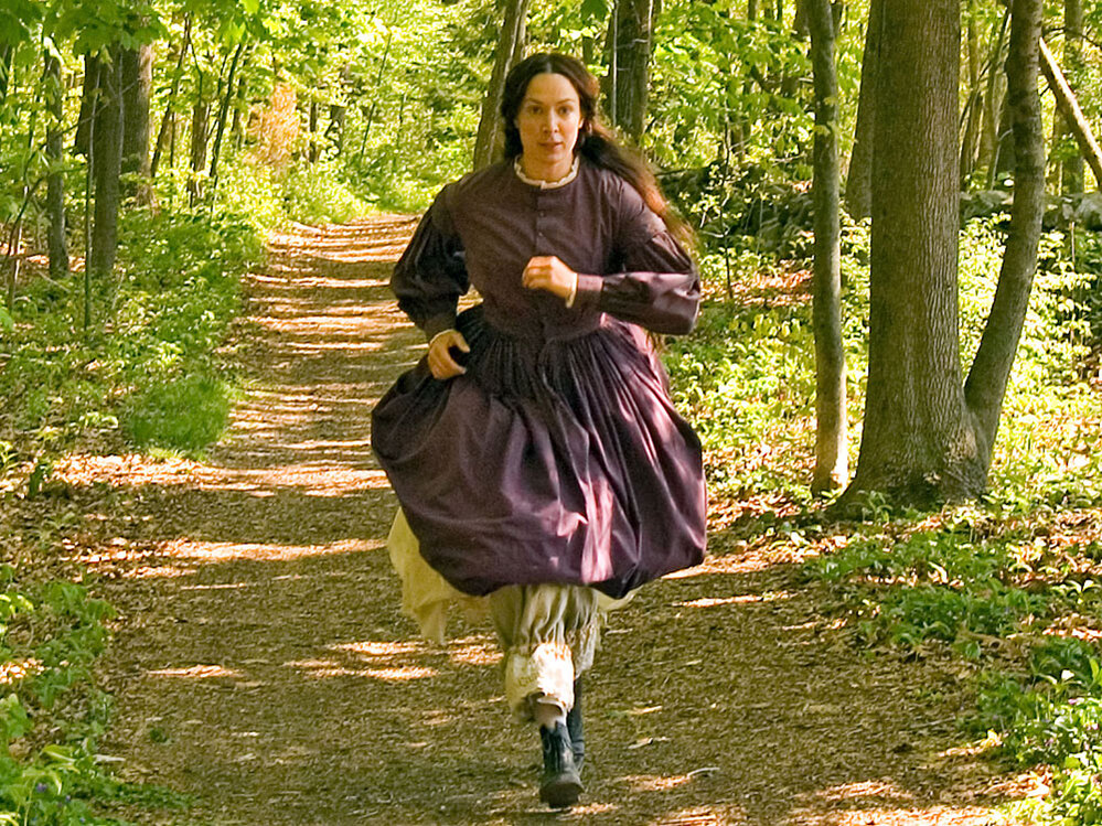 Elizabeth Marvel as Louisa May Alcott, who loved to run.