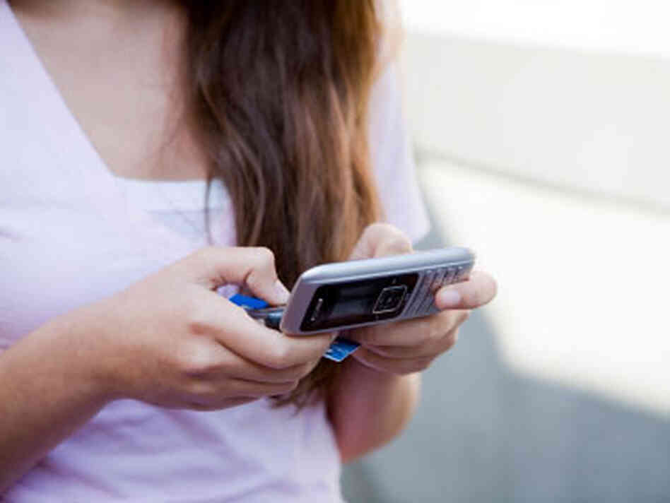 Teenager on cell phone Teenager on cell phone