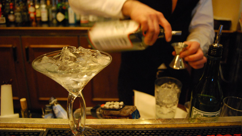 Bonny Wolf's favorite martini in Washington, D.C. is made at the Bombay Club restaurant. Here, Gene Alexeyev chills the glass while measuring the ingredients for a dry martini.