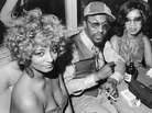 Three patrons sitting in Pepper's Hideout on Chicago's South Side Three patrons sitting in Pepper's Hideout on Chicago's South Side