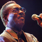 Wilson Pickett, photographed in 2003 with microphone in hand.