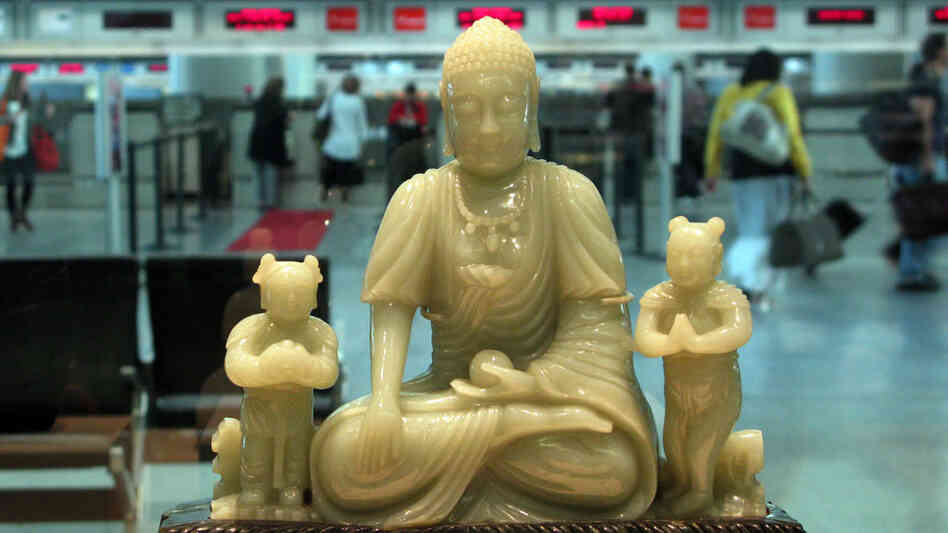 Buddha and his attendants preside over the Virgin Atlantic ticket counter at SFO. Buddha and his attendants preside over the Virgin Atlantic ticket counter at SFO.