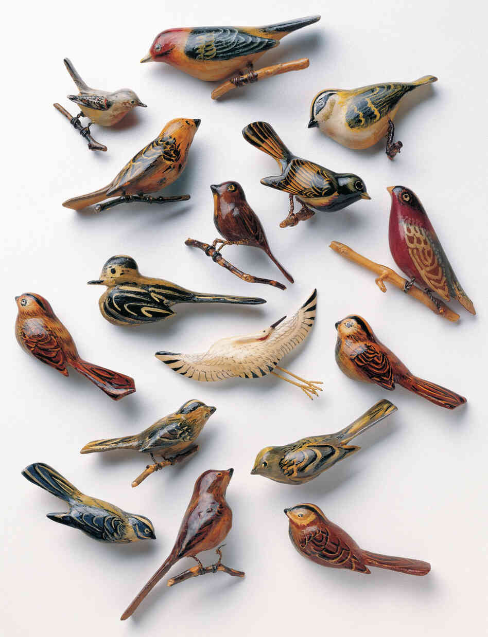 Bird and animal pins made of scrap wood, paint and metal.