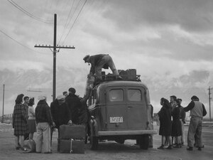 Loading bus, leaving Manzanar for relocation. Loading bus, leaving Manzanar for relocation.