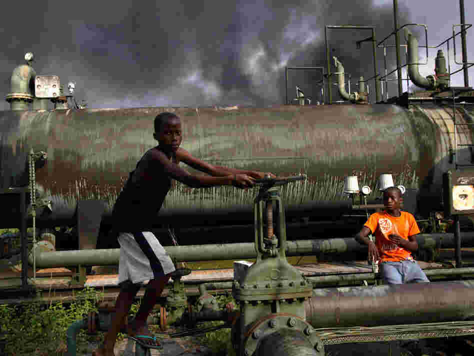 Children playing on a oil flow station in Nigeria