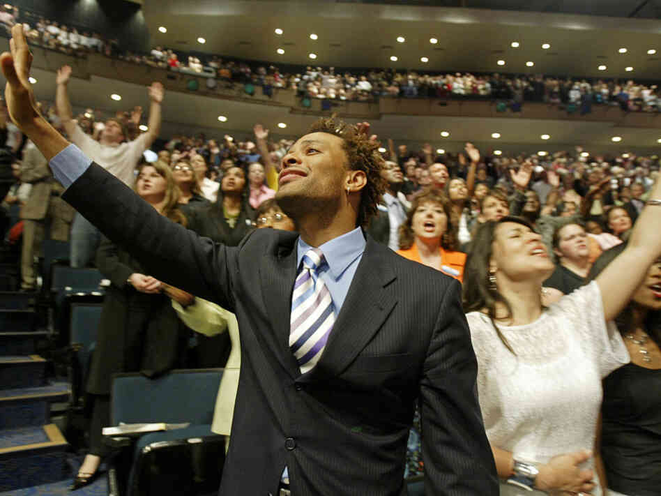 Members of the Lakewood Church worshipping in Houston