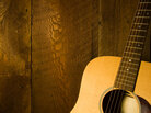 Guitar along wooden planks Guitar along wooden planks