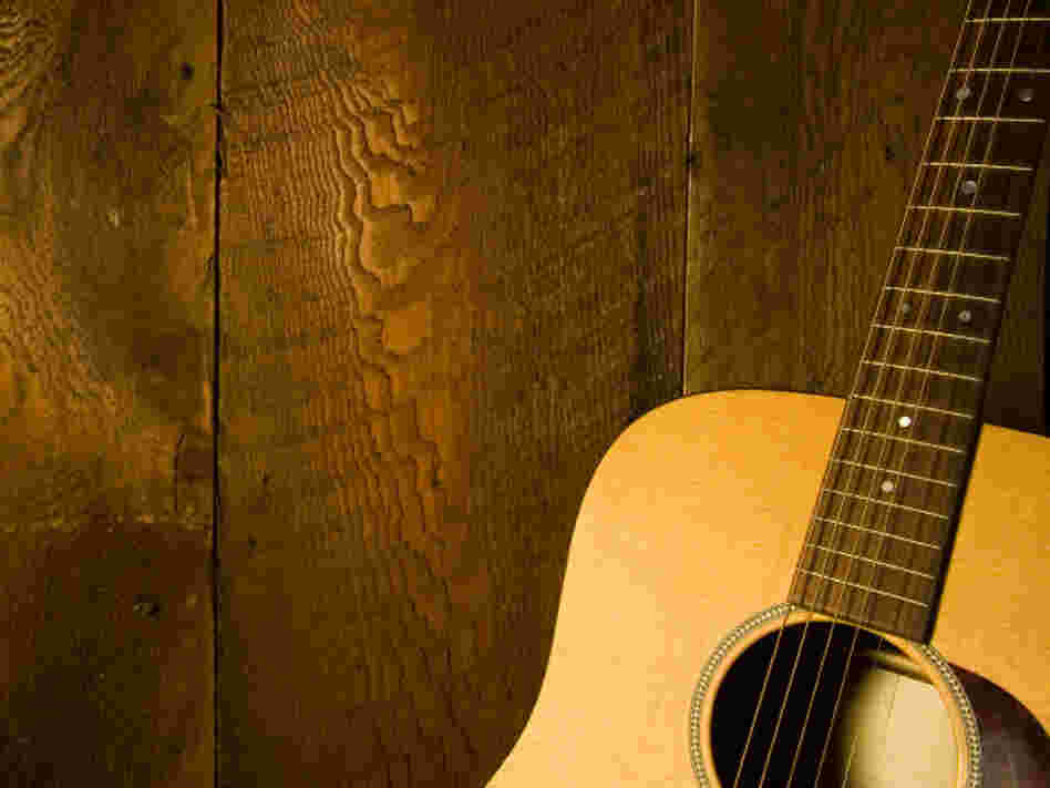 Guitar along wooden planks Guitar along wooden planks