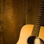Guitar along wooden planks Guitar along wooden planks