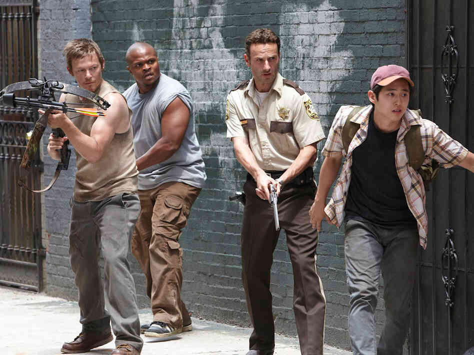 Daryl Dixon (Norman Reedus), T-Dog (Robert Singleton), Rick Grimes (Andrew Lincoln) and Glenn (Steven Yeun) 