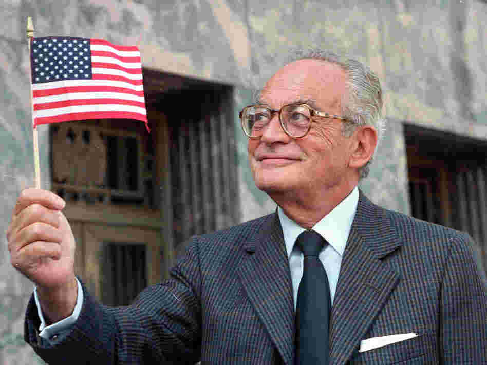 Dino De Laurentiis with an American flag