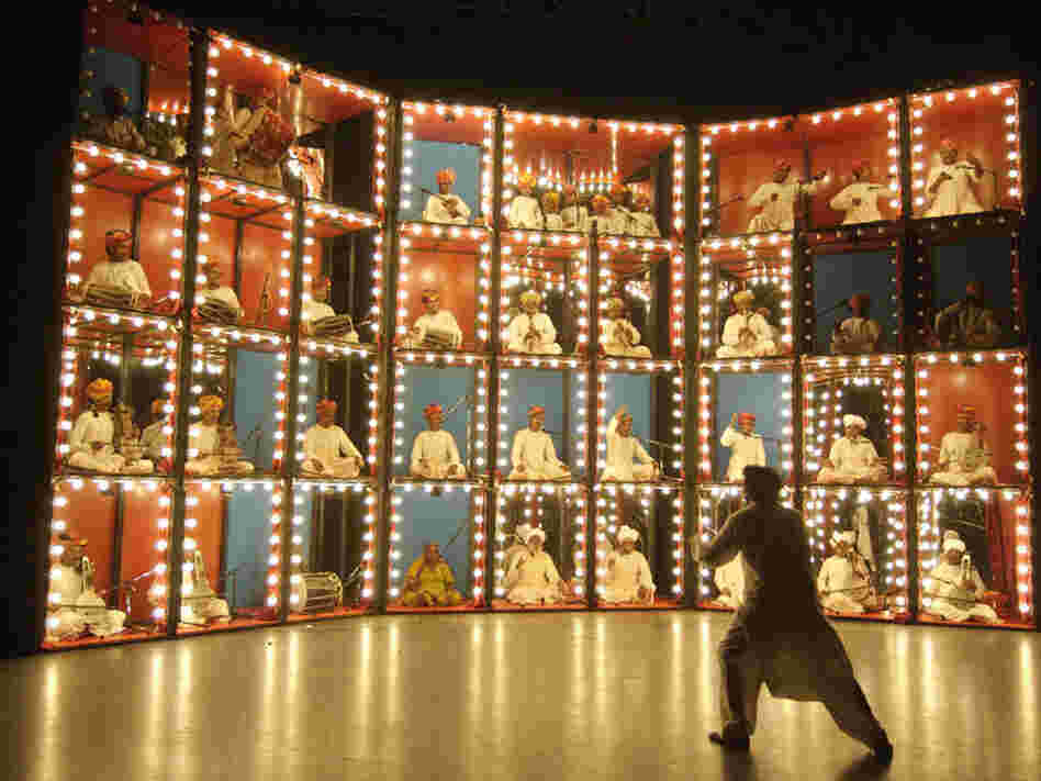 Musicians in lit-up boxes 