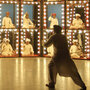 Musicians in lit-up boxes 
