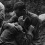 Soldiers hugging on battlefield Soldiers hugging on battlefield