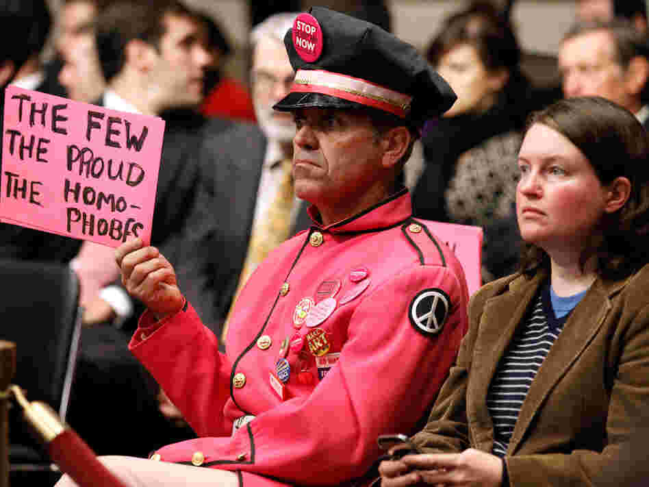 Protester at "don't ask, don't tell" hearings in Washington