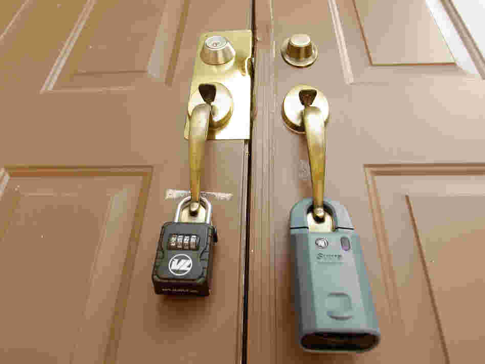Locks on the doors of a foreclosed home