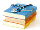 Stethoscope on a pile of books Stethoscope on a pile of books