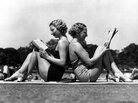 Two women reading back to back as they sunbathe in Hyde Park, London in May 1937. Two women reading back to back as they sunbathe in Hyde Park, London in May 1937.