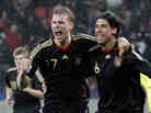 Germany's Sami Khedira (right) celebrates with teammate Per Mertesacker. Gero Breloer/AP 