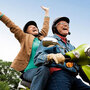 Happy people on a moterbike.