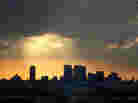 Sunlight filters through clouds over West Hollywood, Calif.