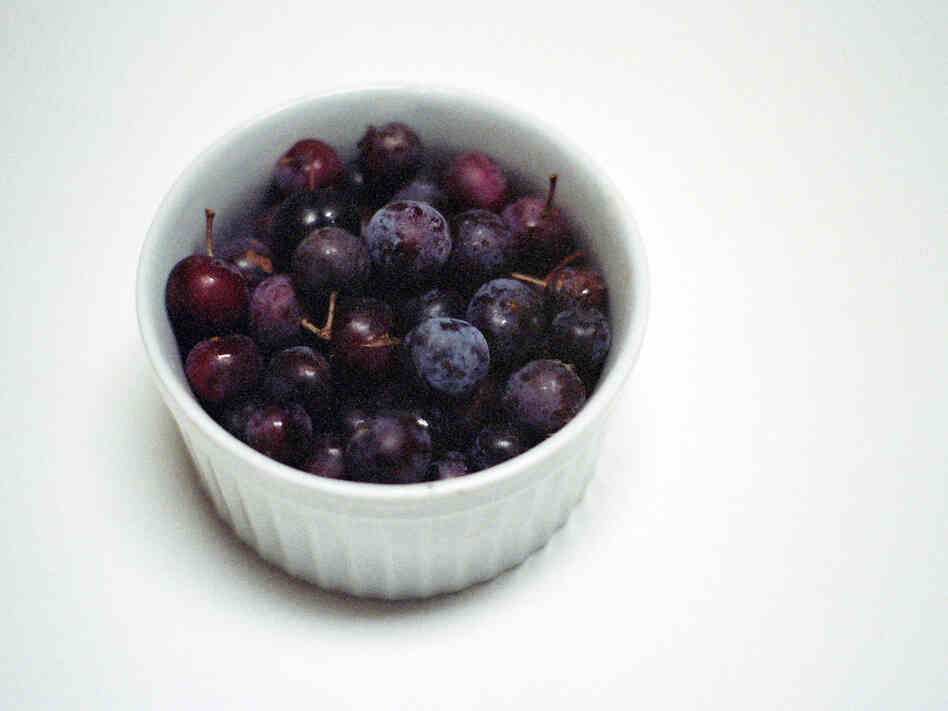 Beach plums in a white ramekin
