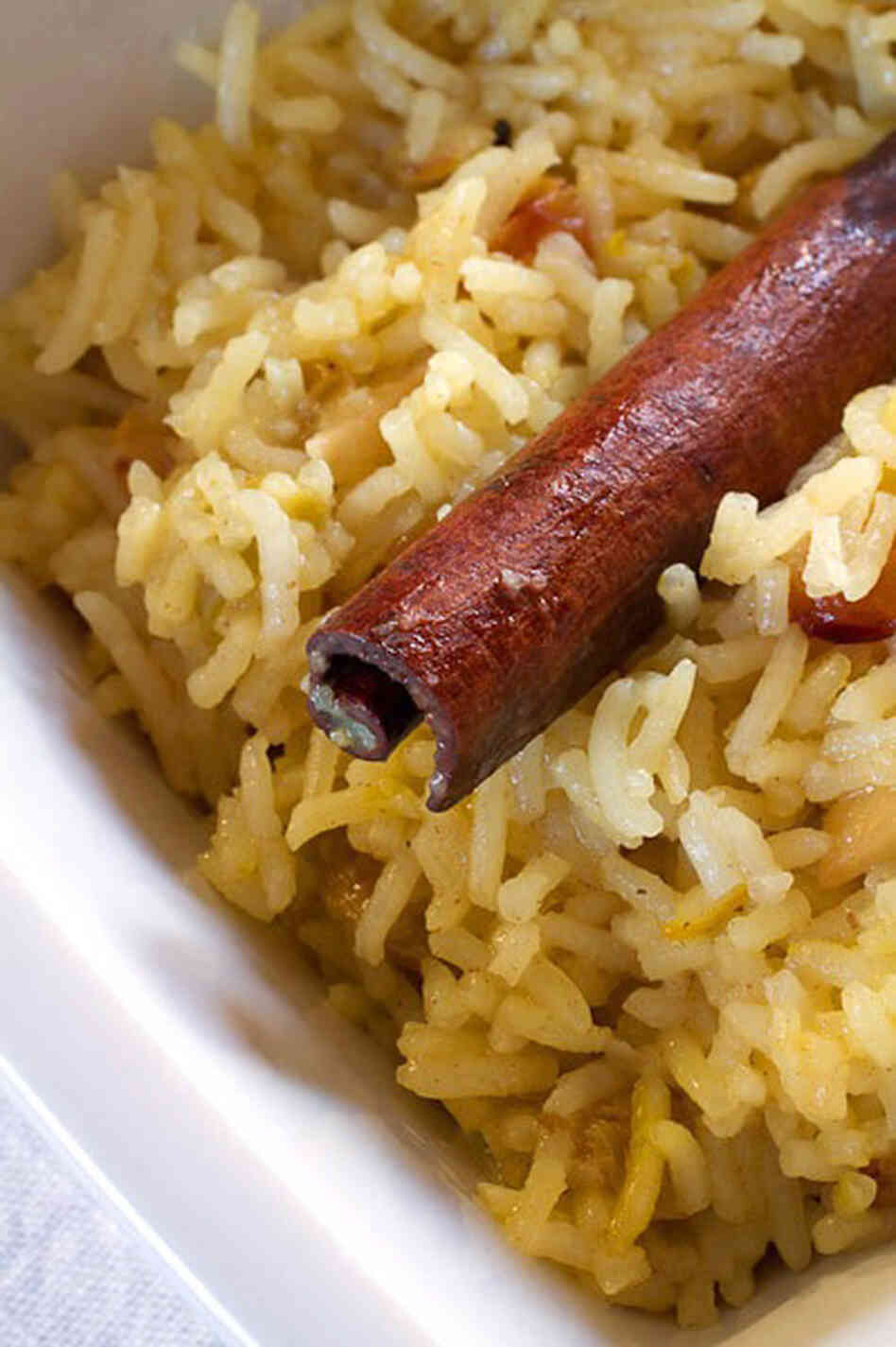 Saffron rice, with a garnish of a cinnmon stick: sweet, with a hint of spice. Saffron rice, with a garnish of a cinnmon stick: sweet, with a hint of spice.