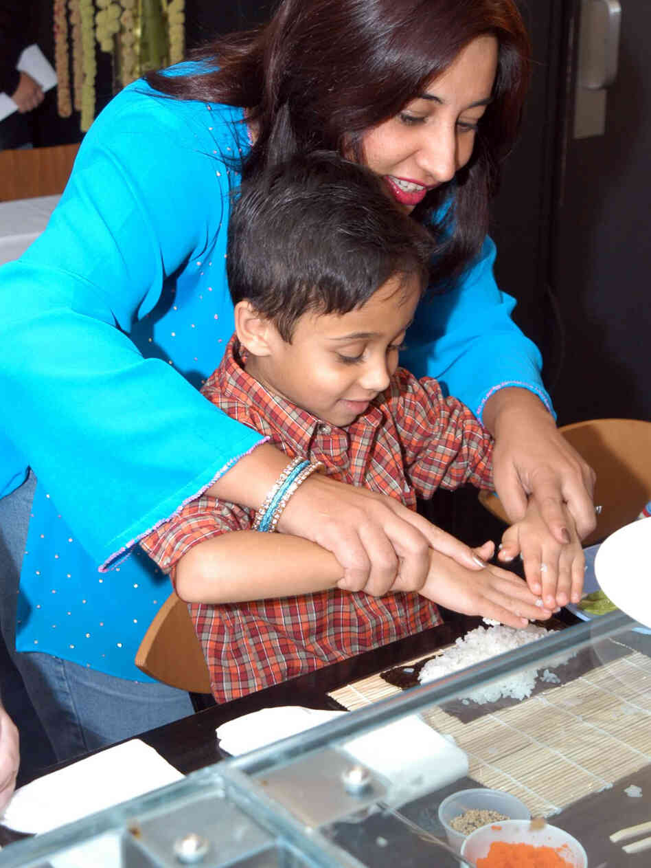 Monica Bhide and son making sushi