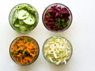 Salads (from left) in small round bowls: Cucumber, Carrot, Beet and Cole Slaw Salads (from left) in small round bowls: Cucumber, Carrot, Beet and Cole Slaw