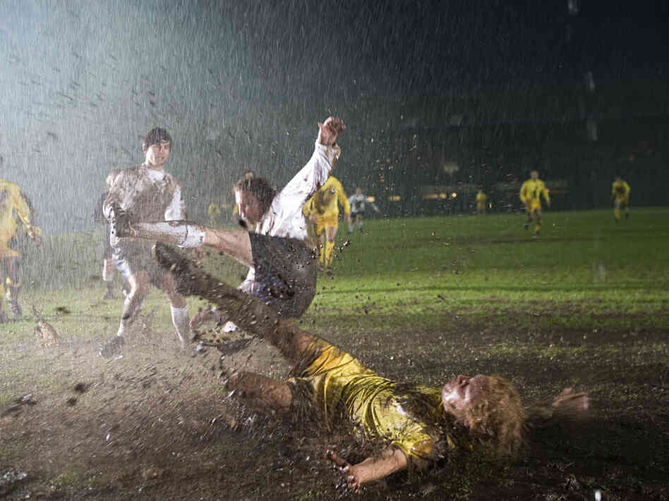 Billy Bremmer (Stephen Graham) performing a slide tackle in the mud