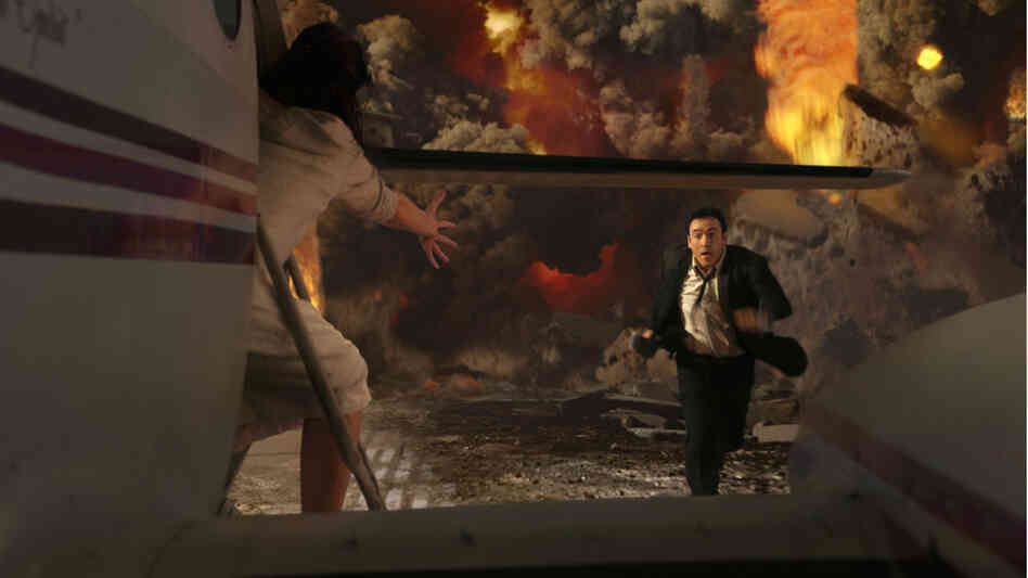 John Cusack runs through the mayhem in '2012'. John Cusack runs through the mayhem in '2012'.