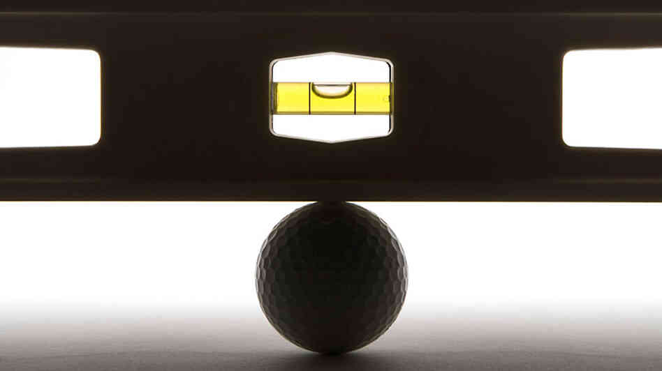 Level balancing on a golf ball.