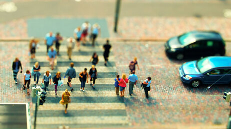 A miniature of people crossing the street.
