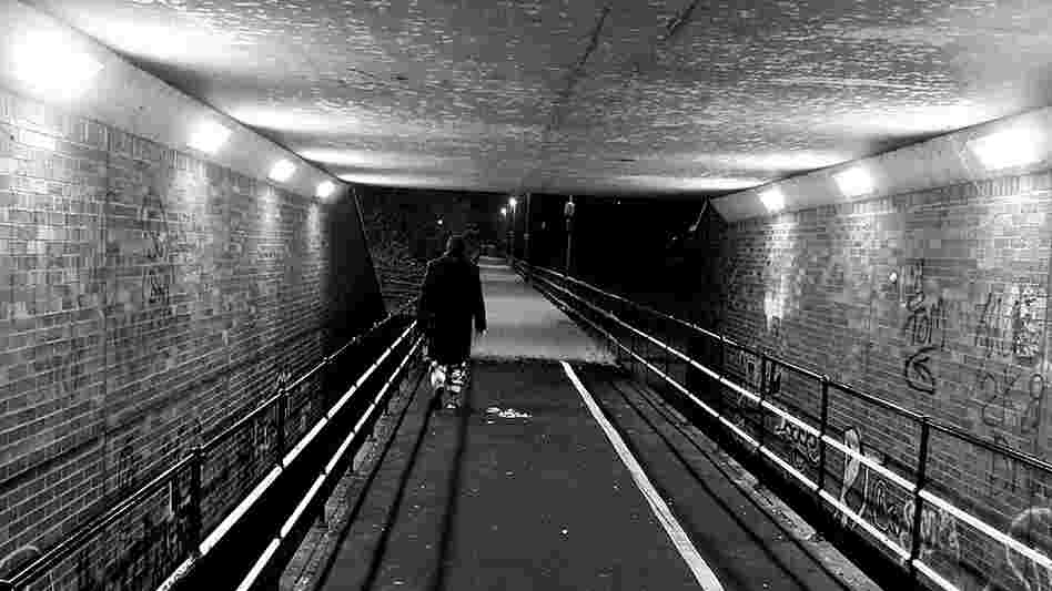 Man walking in a tunnel. Man walking in a tunnel.