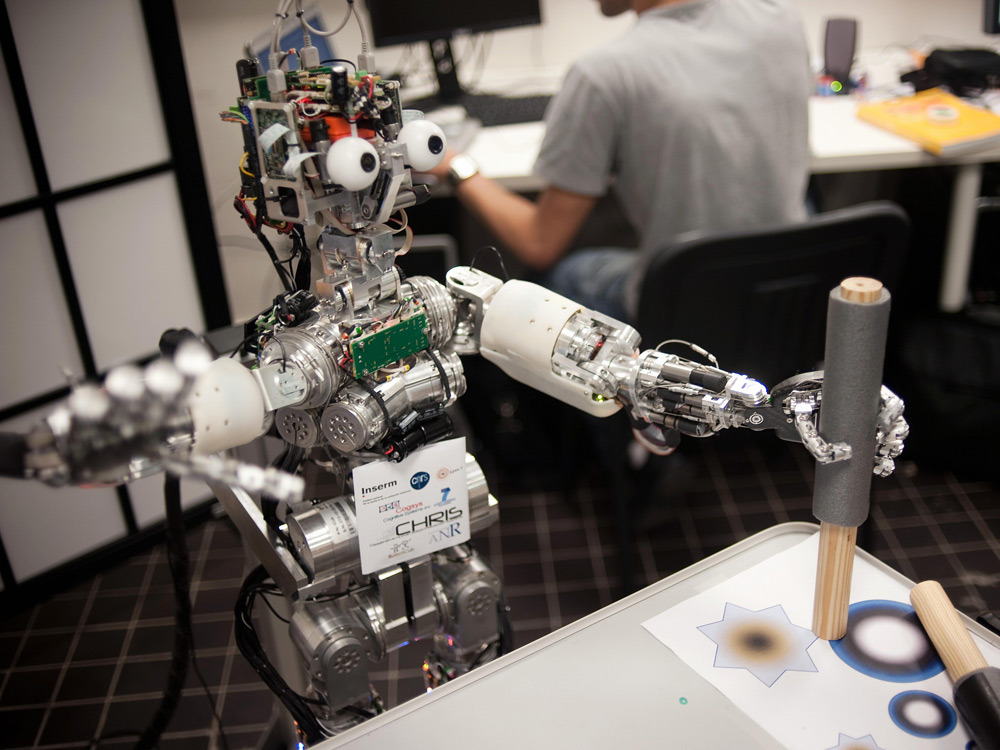 Picture of the iCub robot taken on July 1, 2009, near Lyon, France. The iCub robots are about the size of three-year-old children. Credit: FRED DUFOUR/AFP/Getty Images.