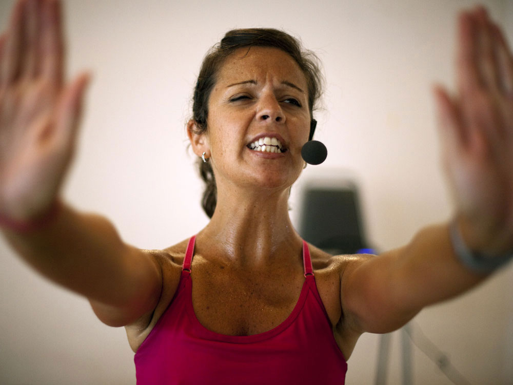 Fitness instructor shouts instructions