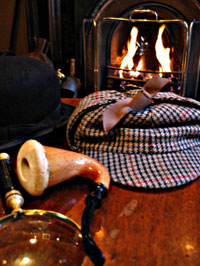 sherlock holmes-style hat, a magnifying glass and pipe beside a fire.