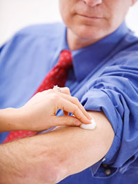 A businessman gets vaccinated.