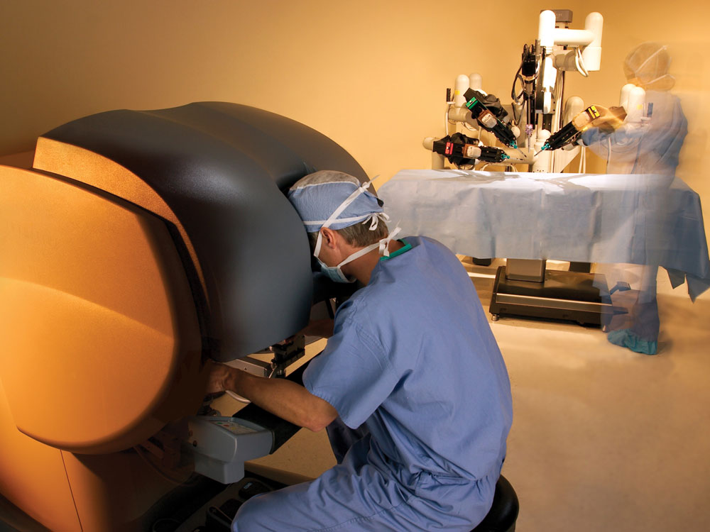Prostate surgeon at robot console.