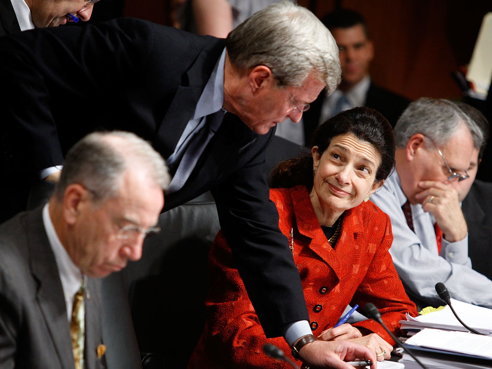 Sen. Max Baucus talks health care with Sen. Olympia Snowe.