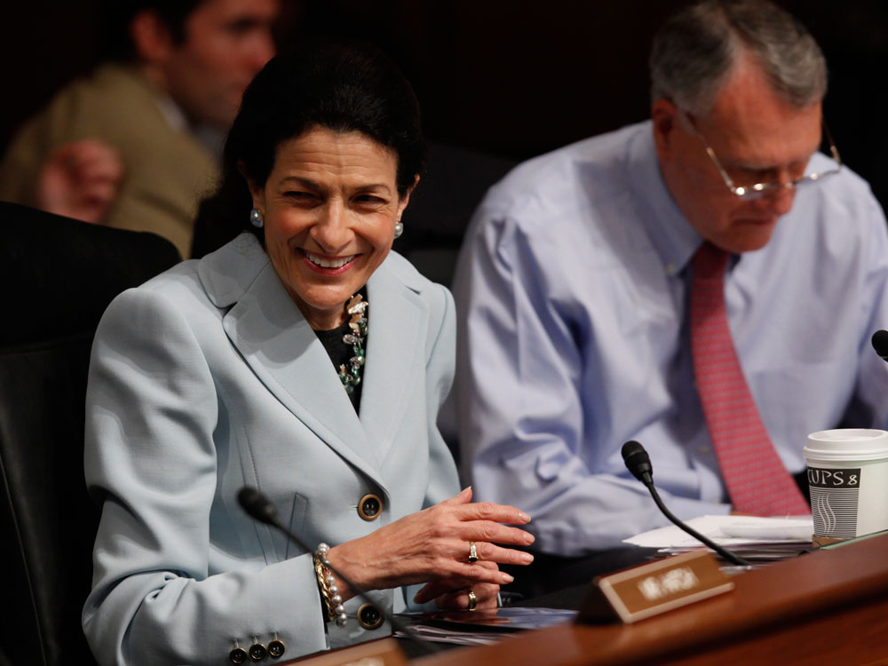 Sen. Olympia Snowe (R, Maine) beams after saying she would vote for the Senate Finance Committee's bill to overhaul health care.
