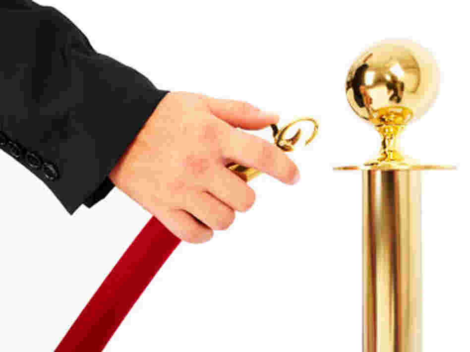 A velvet rope is opened.