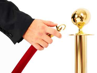 A velvet rope is opened.