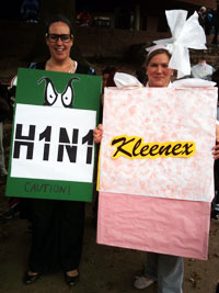 Women wearing H1N1 virus and Kleenex costumes get together for Halloween.