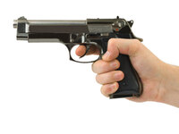 A hand holding a gun.