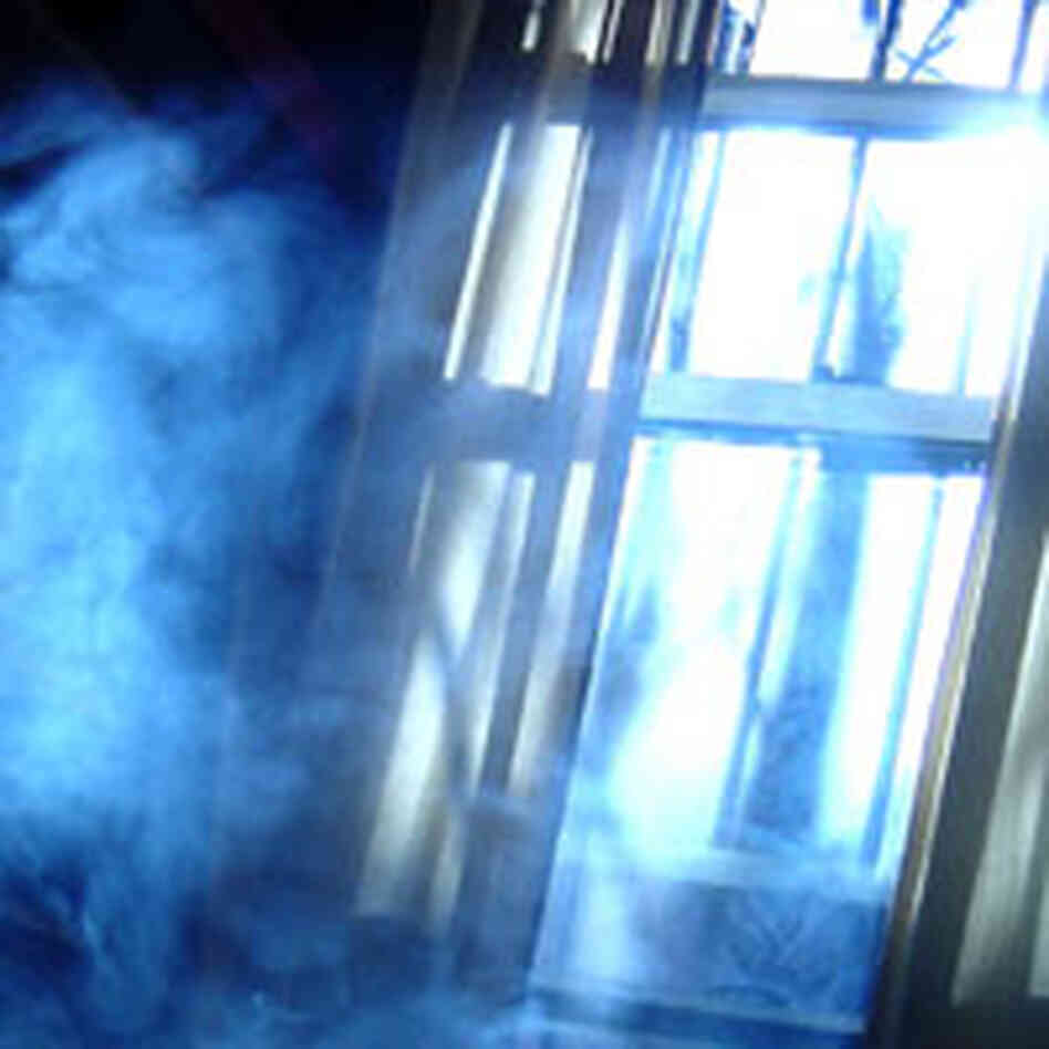 Sunshine enters the window of a dark, smoky room. Sunshine enters the window of a dark, smoky room.