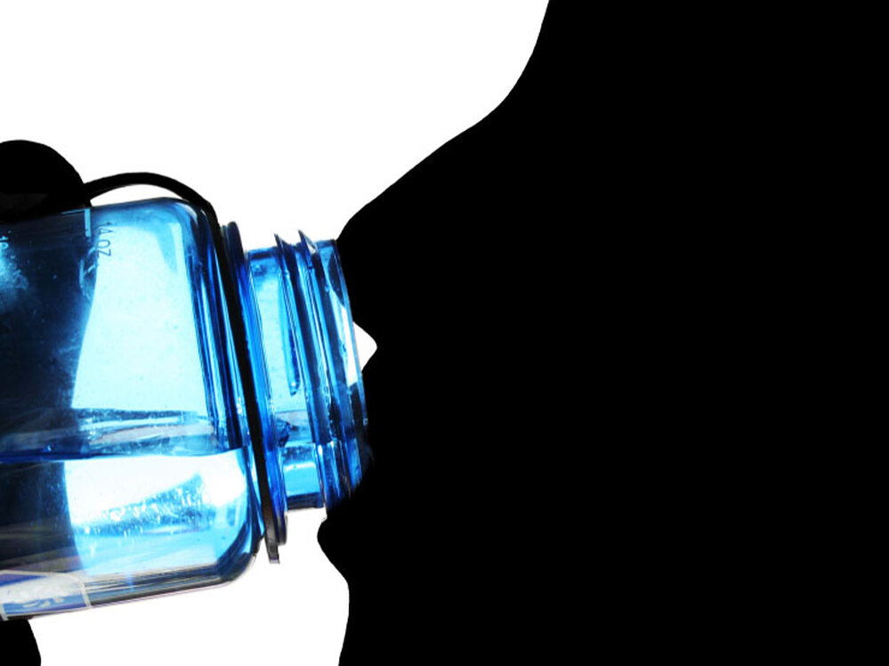 Face drinking from blue plastic water bottle.